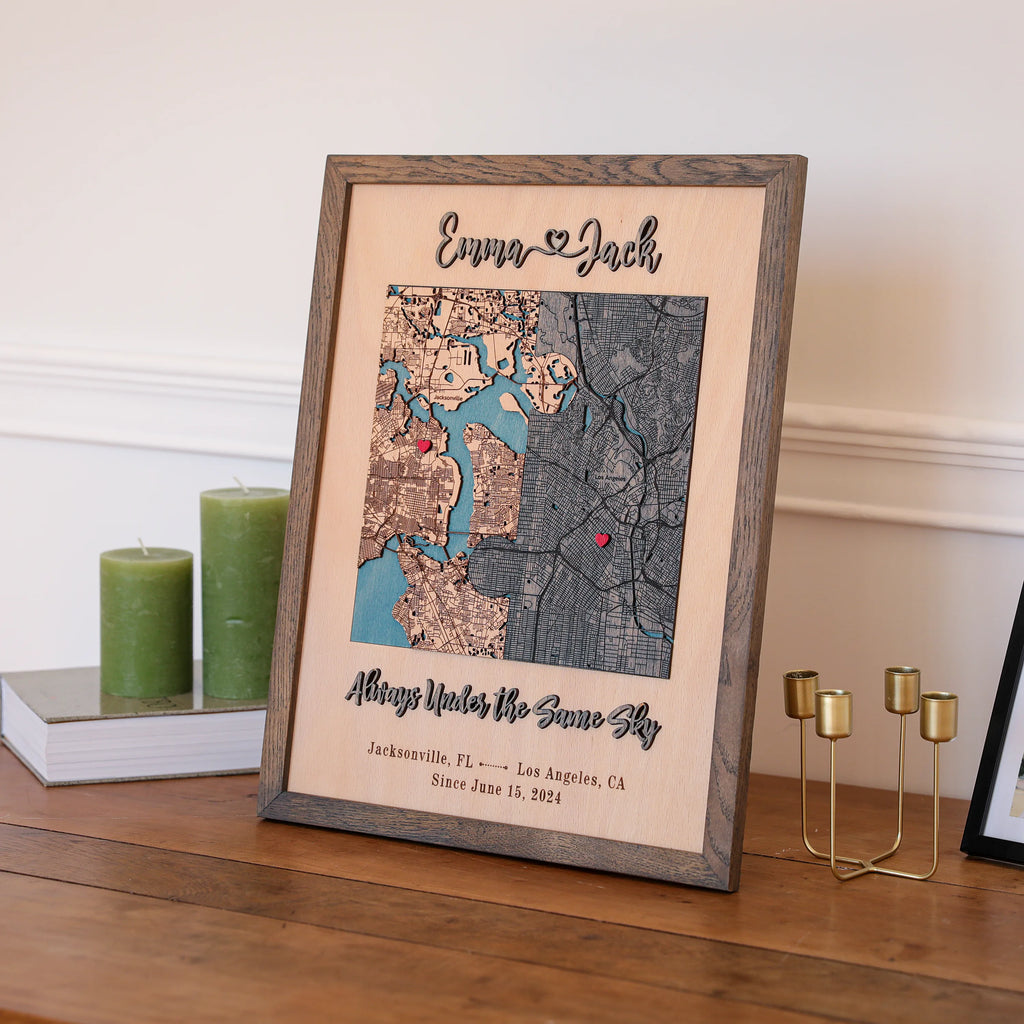 Wooden anniversary map for him in grey oak frame displayed on a shelf with custom locations and raised text.
