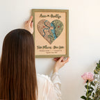 Close-up of wooden couple map with raised 3D names, puzzle heart design, and personalized two-location map.