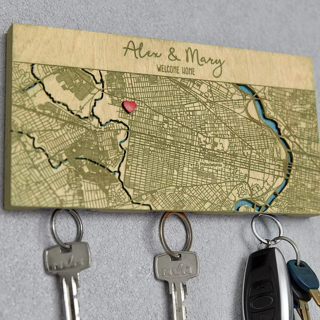 Wooden key rack for wall with custom home map in sage finish and hanging keys close-up