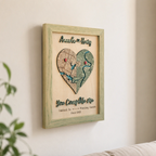 Wooden love story map wall decor in sage frame with heart-shaped custom map, red pins, names, and 3D raised phrase.